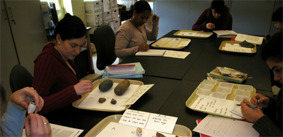 lab Lab Time: Bear examines buttons (right), while Rachel, Stephanie and I study stone tools (left)